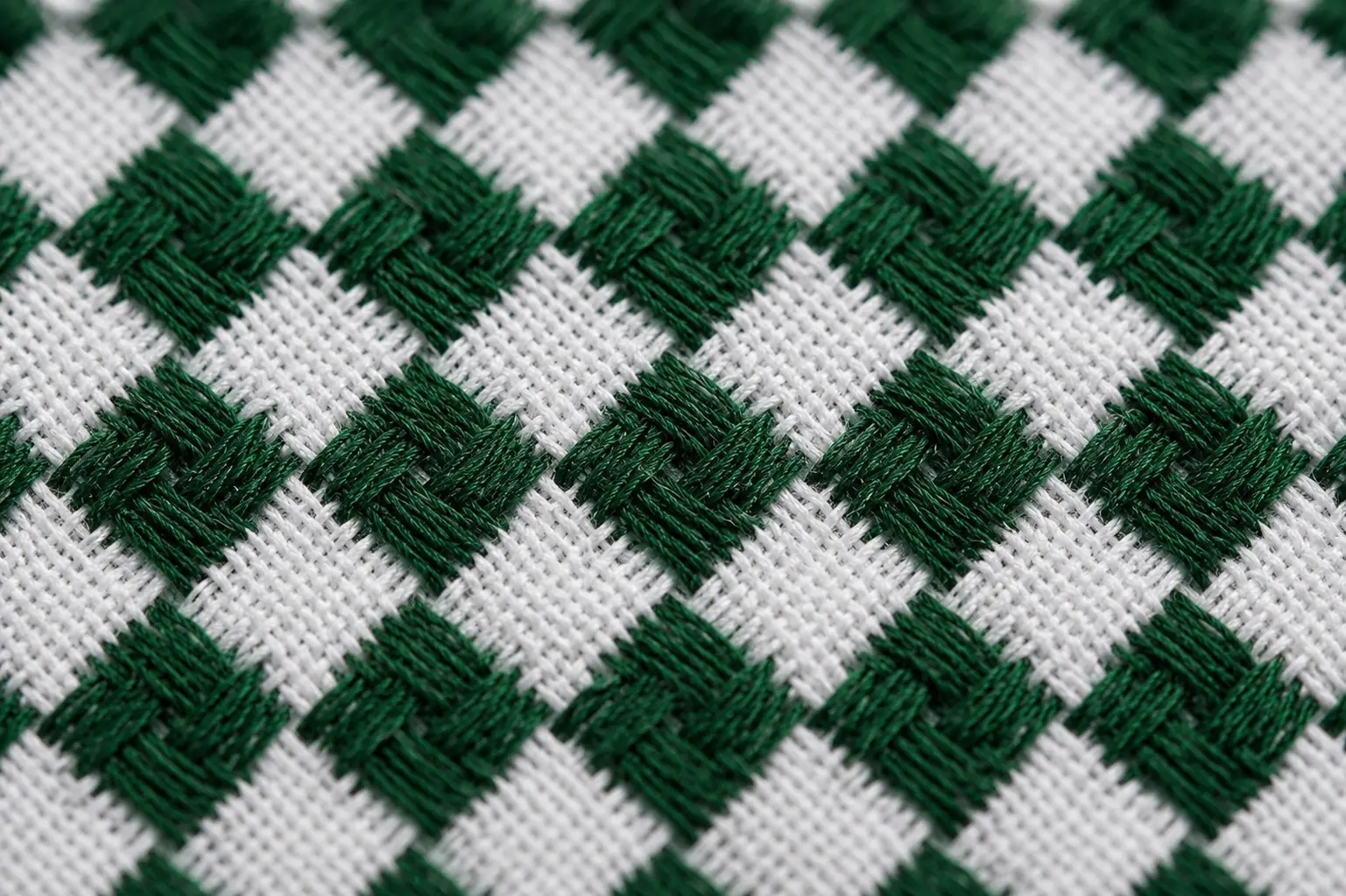 KHAIT Green Edition ghutra detail showing woven check pattern and quality stitching